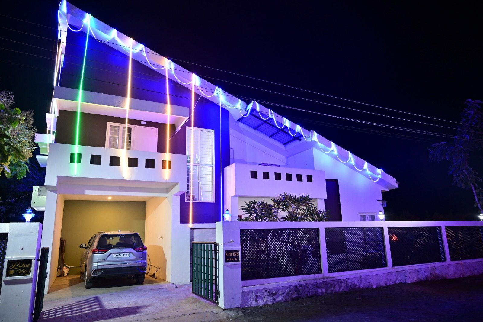 Villa entrance and carport lit up at night