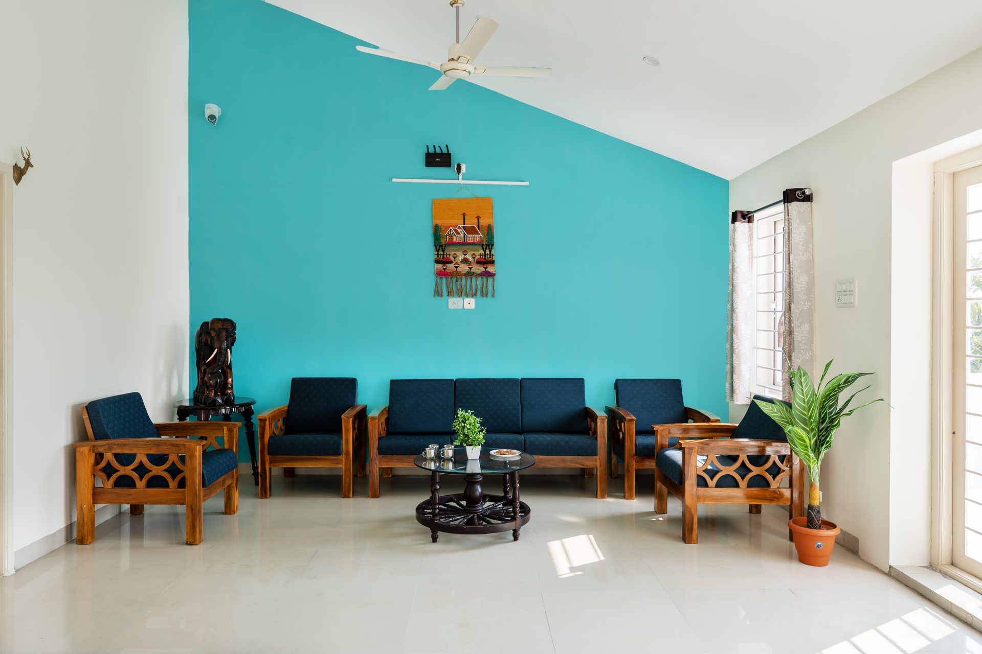 Second living room with blue armchairs