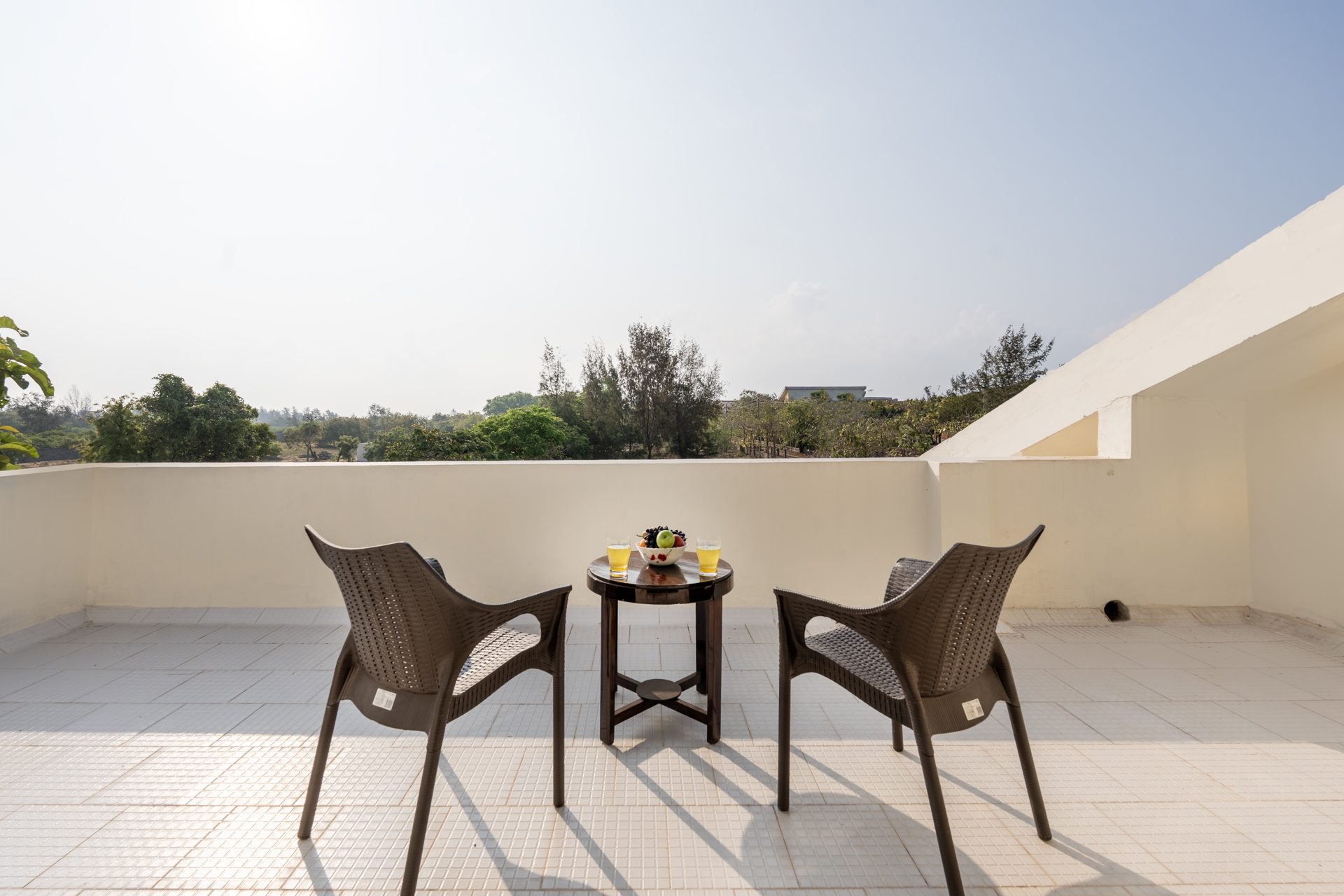 Rooftop terrace with seating overlooking open fields